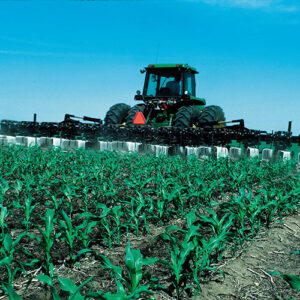 farmer fertilizing field