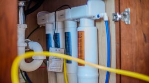 EcoWater Reverse Osmosis drinking water filtration system installed under a kitchen sink by Delmarva Water Solutions.